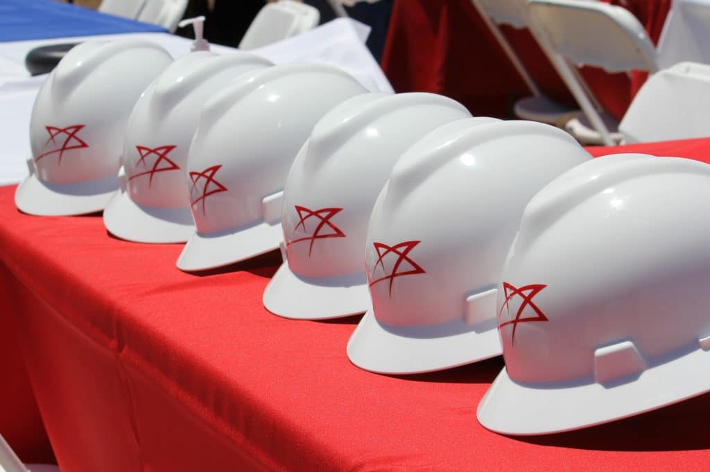 Hard hats with a TexAmericas Center logo illustrates the construction strenghts of the organization.